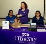 Photograph: [Mary Saffell, and Julie Christenson at TCU demo table]