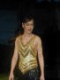 Photograph: [Miss Dragonfly contestant in black and gold dress]