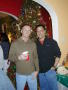 Primary view of [Two guests in front of Christmas tree at Mike and Tong's party]