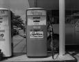 Photograph: [Golden Esso Extra gas pump]