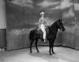 Photograph: [Linda on horseback while on set]