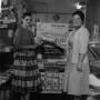 Photograph: [Two women standing in front of Cook Book Cakes display 1 of 2]