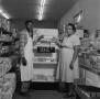 Photograph: [People in front of a pastry display at Quickie Food Market 2 of 2]