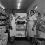Photograph: [People in front of a pastry display at Quickie Food Market 1 of 2]