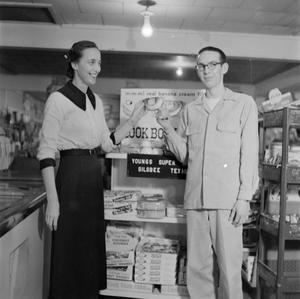 Primary view of object titled '[Showcasing product at a Silsbee food store]'.