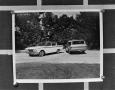 Photograph: [Two parked cars]