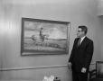Photograph: [Man and a Cowboy Painting]