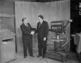 Photograph: [Two men shaking hands on set]