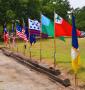 Photograph: [Chapter flags in wind at Jester Park]
