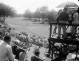 Primary view of [Camera operators and crowds at golf event]