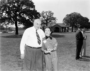 Primary view of object titled '[Man and woman at WBAP picnic]'.