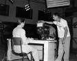 Photograph: [Photo of Frank Mills and Jimmy Turner working at WBAP-TV]