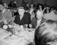 Photograph: [People eating at a banquet]