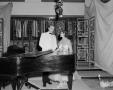 Photograph: [Couple by piano]