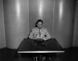 Photograph: [Photo of man sitting at table]