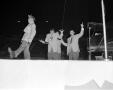 Photograph: [Photograph of four men performing on stage]