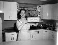 Photograph: [Photo of Margaret McDonald advertising Cook Book bread]