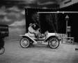 Photograph: [Ann Alden in old automobile]