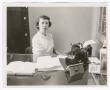 Photograph: [Photo of Fay Cothern in an office]