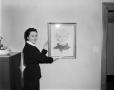 Primary view of [Margaret McDonald holding a portrait drawing of Mrs. Tucker]