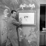 Photograph: [Photograph of Johnny Hay drawing on set]