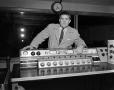 Photograph: [Photograph of television console with Bruce Howard]
