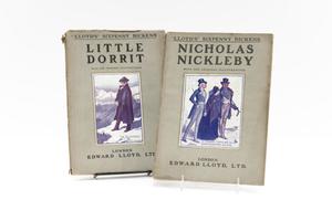 Two books by each other are seen by their covers. They are title Little  Dorrit on the left, and Nicholas Nickleby on the right. The covers are  grey, with black letters. The drawing on the book on the right is of a  man in a large coat. The drawing on the cover on the right is of two men  in coats, with a women in between them in a big dress.