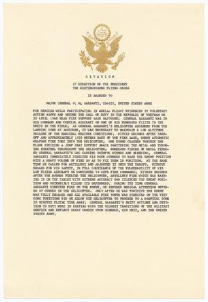 A letter typed on cardstock, with a condensed small paragraph. At the top of it is an eagle insignia, with two leaves in each side of it and a circular symbol at the top. The word Citation is under it.