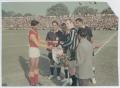Photograph: [Soccer players swapping pennants]