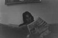 Thumbnail image of item number 1 in: '[Photograph of Byrd Williams IV reading a newspaper]'.