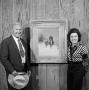 Photograph: [Wygant with Olaf Wieghorst's painting]