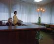 Photograph: [Two women at reception desk]