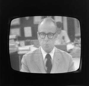 Primary view of object titled '[WBAP news reporter on television]'.