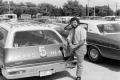 Primary view of [Bernie Tamayo next to a WBAP news vehicle at KXAS]
