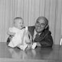 Photograph: [A man and a baby]