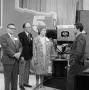 Photograph: [Guests next to a WBAP camera]