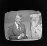 Photograph: [Meteorologist on television]