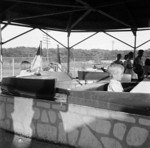 Primary view of object titled '[Photograph of children on a boat ride]'.