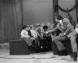 Photograph: [Photograph of Bill Kelley talking to children at a KXAS Christmas Ch…