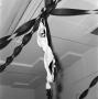 Photograph: [Photograph of a bra and streamers hanging from a ceiling]