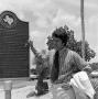 Photograph: [Don Shores with the WBAP historical marker]