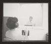 Photograph: [Woman participates in a hearing evaluation, 2]