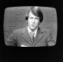 Photograph: [Ron Spain on television]