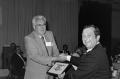 Photograph: [Harold Taft awarding a certificate]
