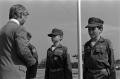 Photograph: [Ted Norman speaking to three Young Marines]