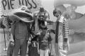 Photograph: [Young boy with Costumed Characters]