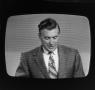 Photograph: [Unknown man on a television screen]