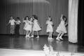 Photograph: [Photograph of young children dancing on stage]