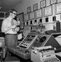 Photograph: [Unknown man with a control panel]