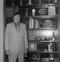 Photograph: [Curly Broyles standing with his possessions]
